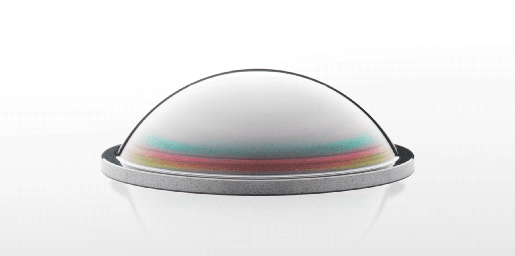 Here's an 8-word alt tag for the image: Dome-shaped lens with colorful internal reflection.