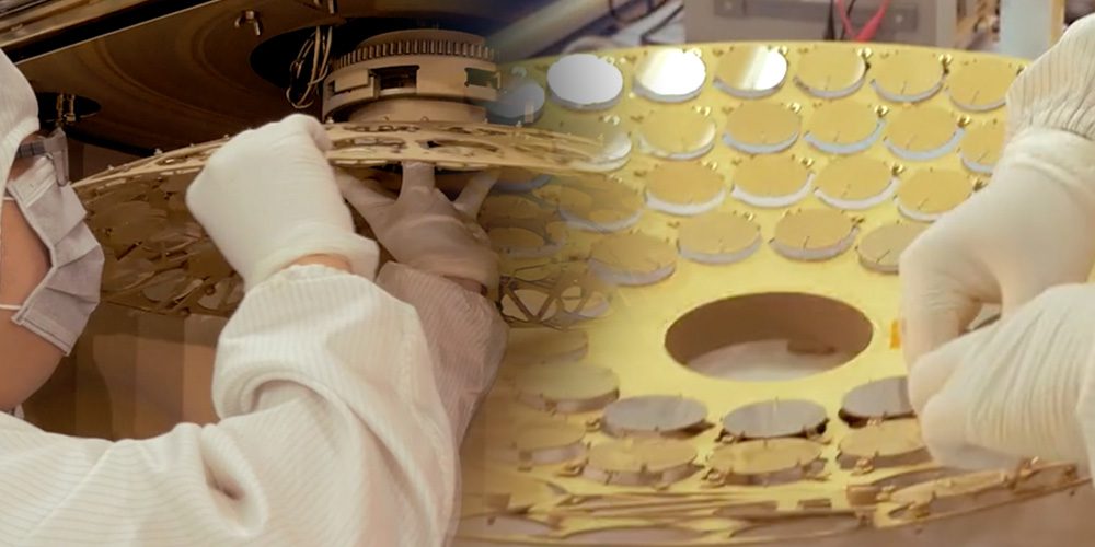 Workers assembling circular component array.