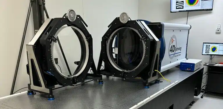 Here's an 8-word alt tag for the image: Two 4D Technology optical scanners in a lab.